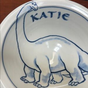 Ward Pottery bowl hand-painted design of a dinosaur with “Katie”